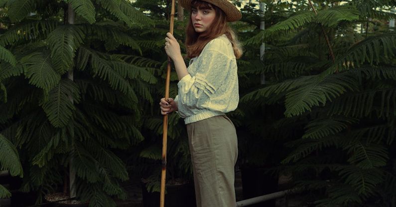 Vertical Gardening - Woman Holding a Gardeners Stick