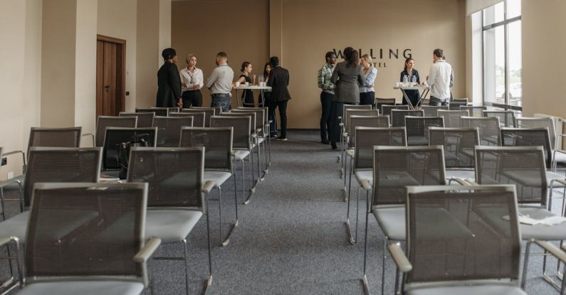 Function - Group of People Standing and Talking in a Room