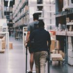 Storage - Men Going Around a Warehouse