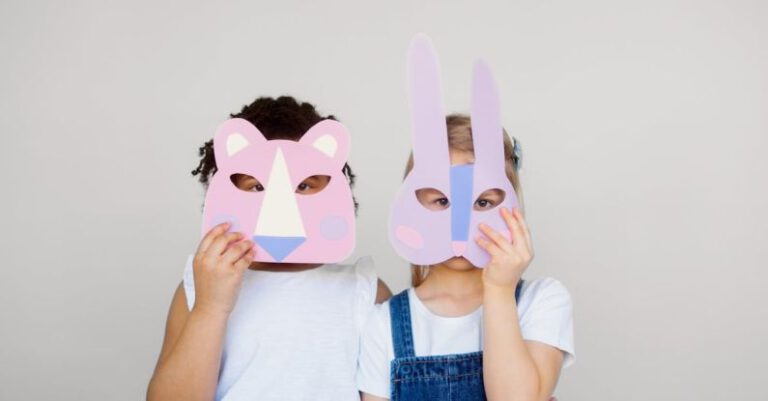 Educational Crafts - Two Kids Covering Their Faces With a Cutout Animal Mask