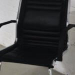 Indoor Air Quality - Chair with black seat placed against brick wall