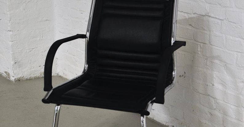 Indoor Air Quality - Chair with black seat placed against brick wall